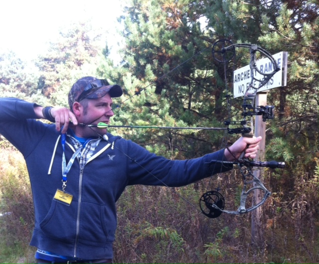 Archer at full draw on an outdoor range