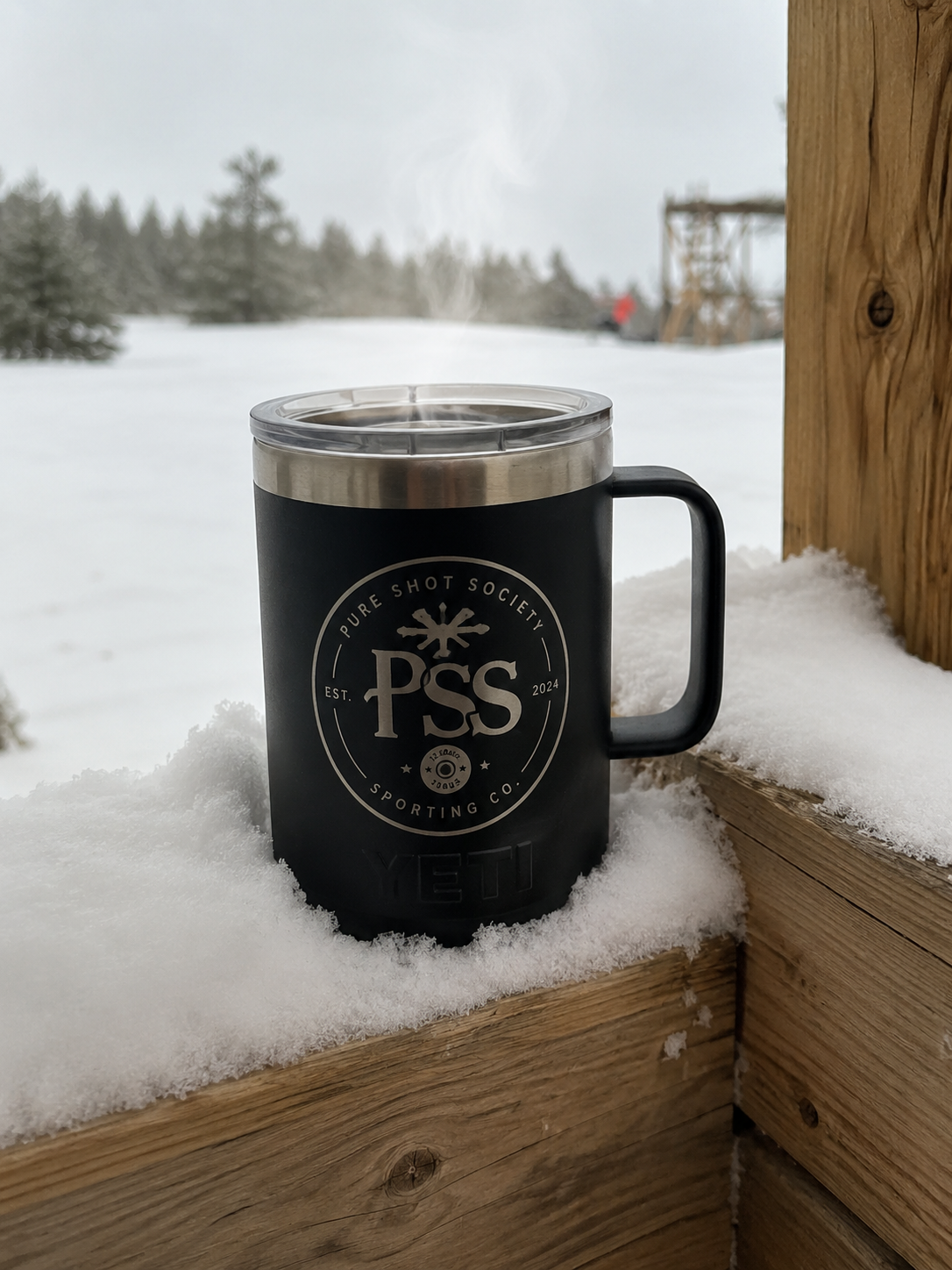 Pure Shot Society mug in the snow at the range